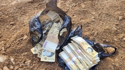 쓰레기매립지서 나온 2900만 원 주인 찾을 수 있던 까닭은?