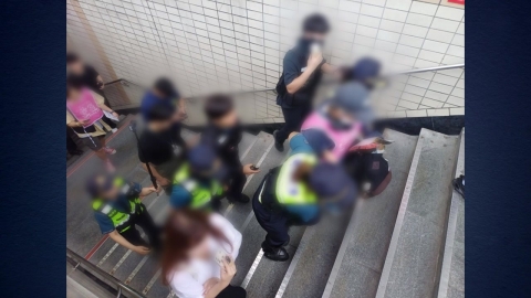 An activist arrested for pushing station workers during a protest.