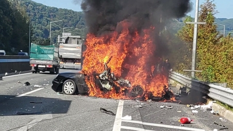 Backing up the highway, an accident set the car on fire...the rescue of the citizens