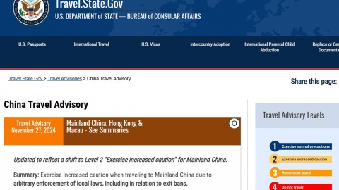 U.S. lowers travel warning to China after exchanging prisoners